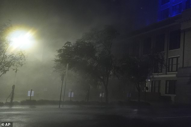 Wind-driven rain soaks a street in downtown Tampa, Florida, as Hurricane Milton passes by