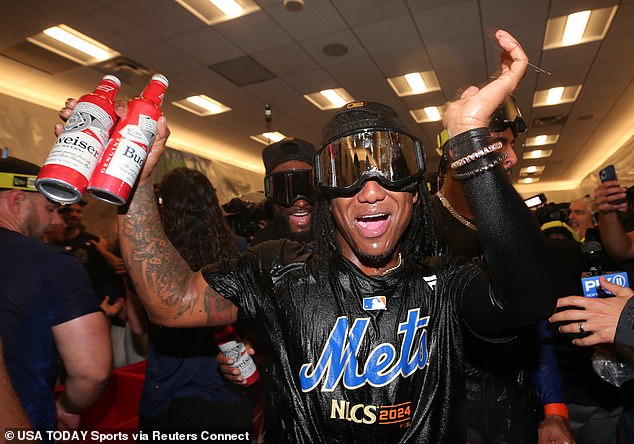 Mets shortstop Luisangel Acuna (2) celebrates in the clubhouse after beating the Phillies