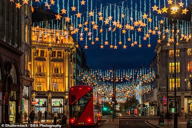 Visitors enjoy seeing the dazzling Christmas lights on Oxford Street (above) - the activity is trending on TikTok with 41,200 posts tagged