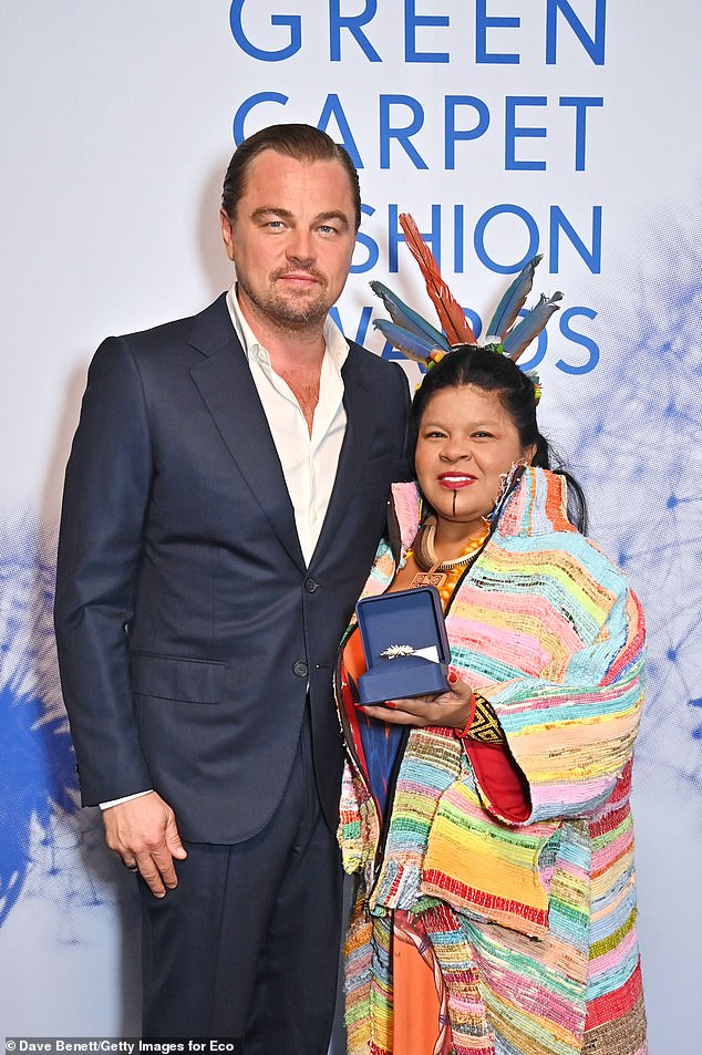 After being ridiculed in 2016 while traveling 8,000 miles by private jet to collect an environmental award, the star traveled commercially to the 2021 COP26 summit (pictured with Sonia Guajajara)