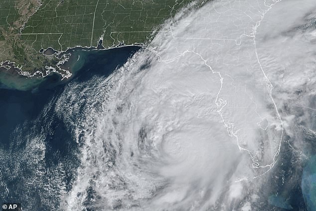 A satellite image shows Hurricane Milton swirling in the Gulf of Mexico and approaching Florida