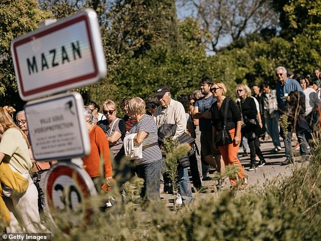 People take part in a march in support of rape victim Gisele Pelicot on October 5, 2024 in Mazan, France