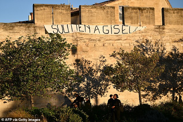 A banner reading 'support for Gisele' displayed on the walls of Avignon on October 10, 2024