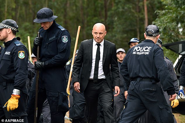 One-time Detective Jubelin, above in signature black suit, during a 2018 police investigation in Kendall into the remains of missing toddler William Tyrrell