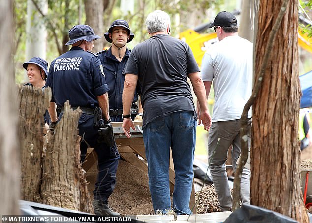 Current strike force commander Chief Inspector David Laidlaw (grey t-shirt, centre) with police officers at William Tyrrell's excavation site on Batar Creek Road, Kendall in 2021