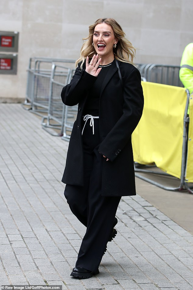 She threw an oversized blazer over the monochrome look and added a pair of chunky heels for her interview day at the BBC