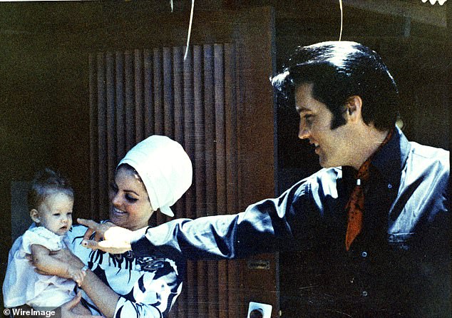 Lisa Marie pictured with her father Elvis Presley and mother Lisa Marie Presley