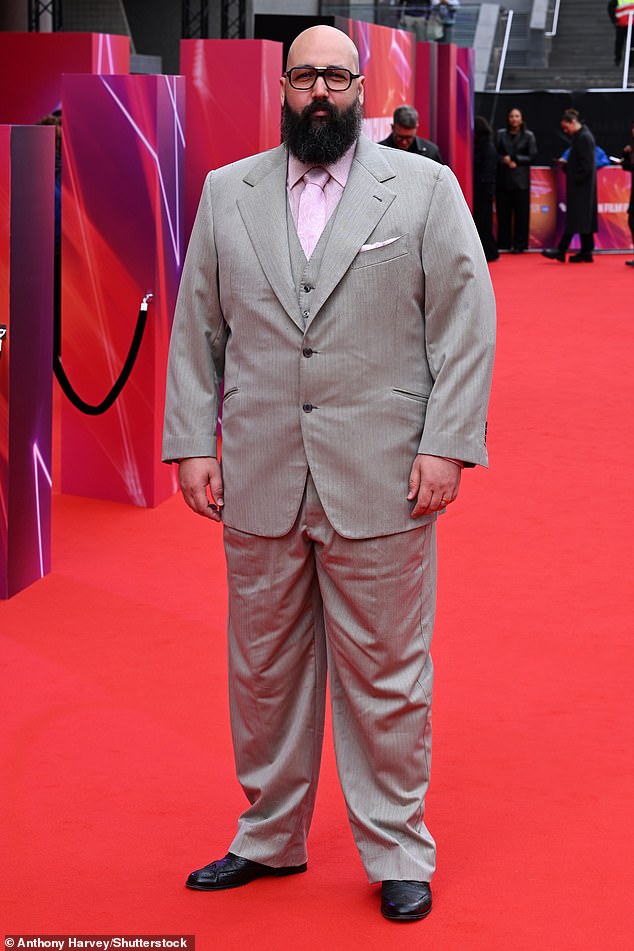 Youssef Kerkour wore a light gray three-piece suit