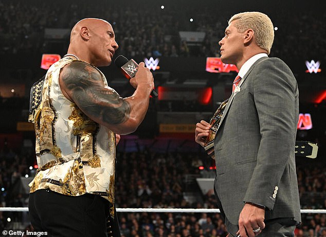 The match would also involve current WWE Champion Cody Rhodes (right) in a likely title fight