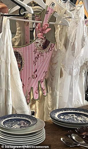 The Descendants actress shared a snapshot of a pink corset hanging above a table of fine china