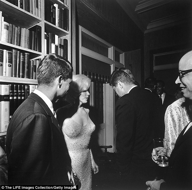 During a party at film director Arthur Krim, Marilyn Monroe stands between Bobby and JFK in New York in 1962. Both brothers had affairs with Monroe, possibly at the same time.