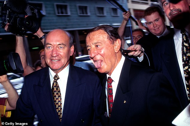 Former NSWRL chief executive John Quayle (left) arrives at court with ARL chairman Ken Arthurson during the Super League war