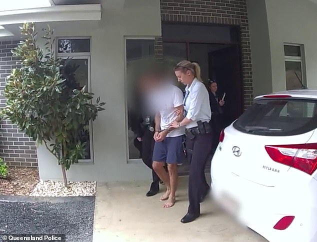 He is pictured being escorted from his home in Queensland on Thursday