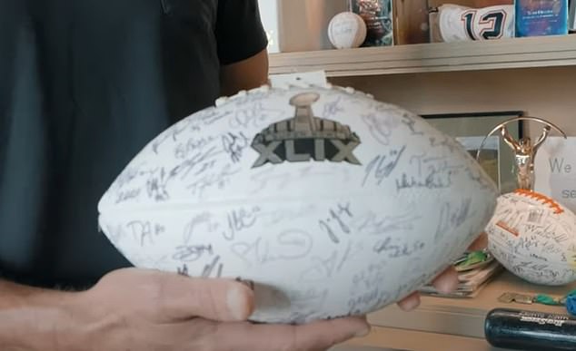 Brady also showed off a ball that the entire Patriots team signed before Super Bowl XLIX