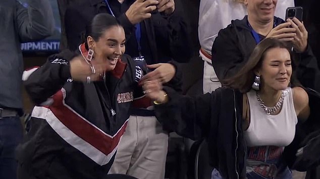 Claire Kittle (left) and Kristin Jusczcyk celebrate as their husbands led the 49ers to a victory