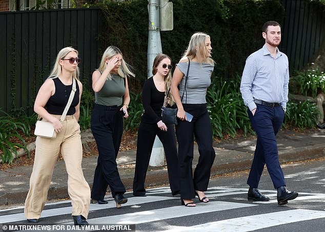 Friends of Savana Calvo cross the road to St. Mark's Church