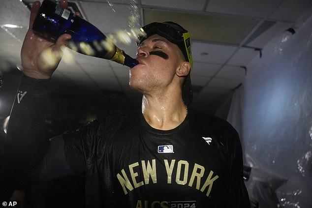 Aaron Judge took a long sip of champagne after the Yankees wrapped up the ALDS