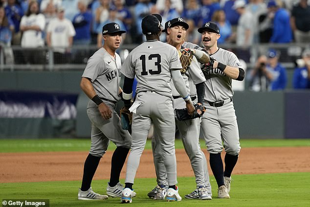 The Yankees celebrate after beating the Royals on Thursday night at Kauffman Stadium