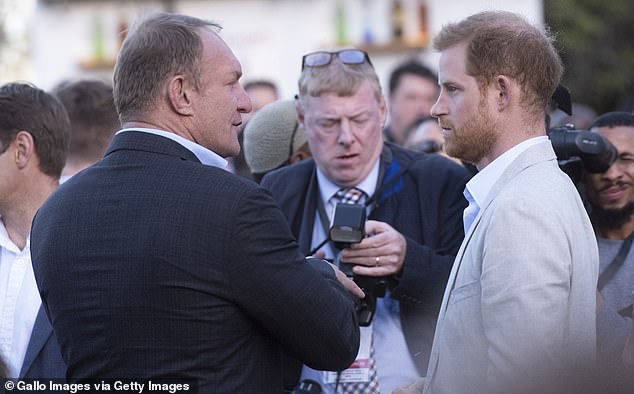 An unhappy-looking Prince Harry with photographers during his 2019 tour of South Africa