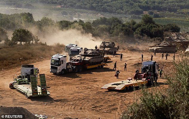 An Israeli Army tank is transported amid cross-border hostilities between Hezbollah and Israel, in northern Israel, October 10, 2024