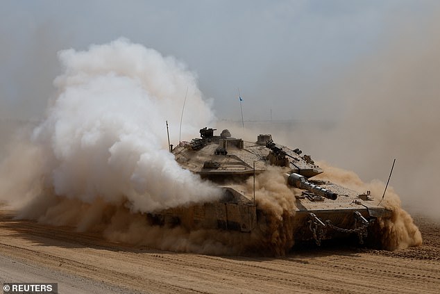 An Israeli tank maneuvers near the Israel-Gaza border, amid the ongoing conflict between Israel and Hamas, in southern Israel, October 6, 2024