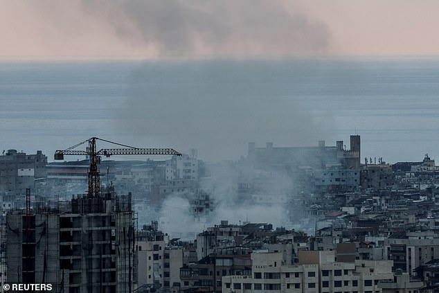 Smoke rises over Dahiyeh in the southern suburbs of Beirut following Israeli airstrikes, amid ongoing hostilities between Hezbollah and Israeli forces, seen from Sin El Fil, Lebanon, October 10, 2024