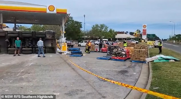 Crews attend a truck rollover at a Sutton Forest servo in NSW