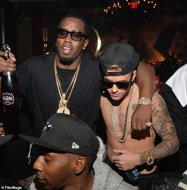 Justin is said to be 'disgusted' by the accusations against Diddy, who was a mentor to him early in his music career (pictured together in 2014)