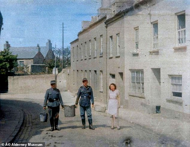 Nazi soldiers with a woman on the island in 1942