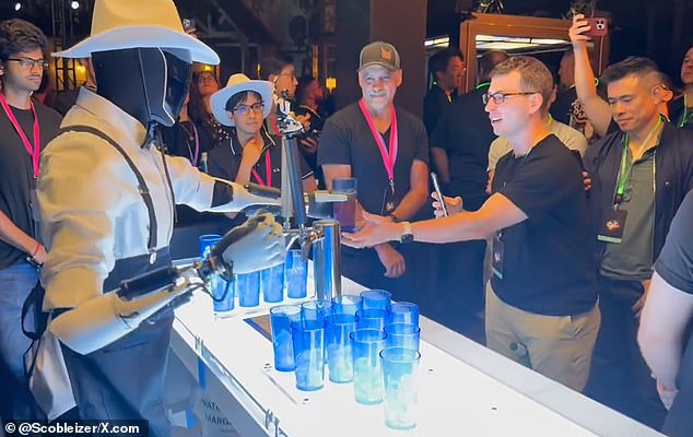 The guests of the event were amazed by the bartending robot's ability to pour and serve drinks