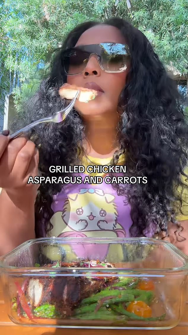 Lizzo, seen here eating her dinner of grilled chicken, carrots and asparagus, said she wouldn't judge anyone else on their diet, whether raw vegan or meat eater