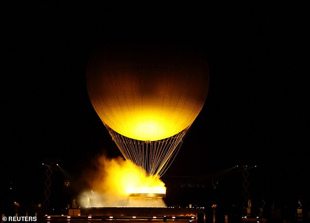 The Olympic cauldron is lit during the opening ceremony of the Paris 2024 Olympic Games