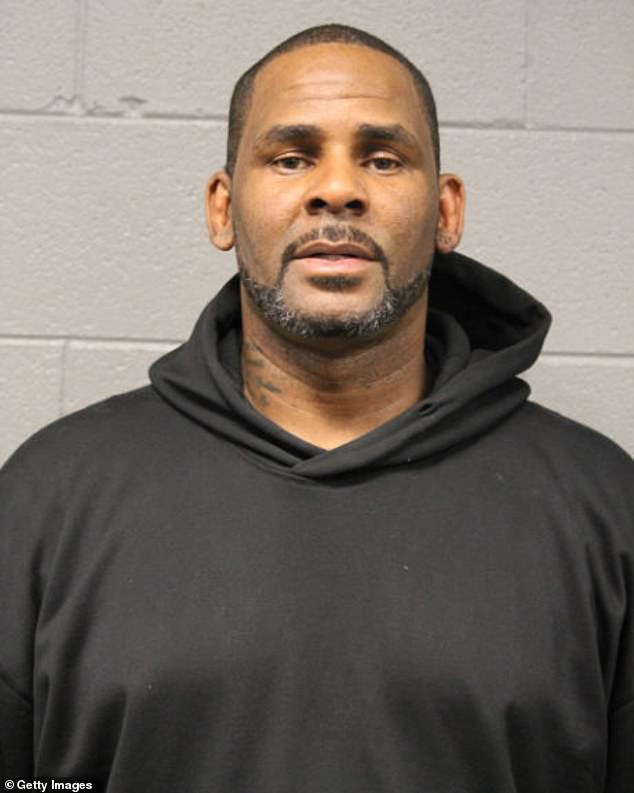 She said she first reported his alleged misconduct to her mother in 2009, when she was about ten years old; R. Kelly is seen in his February 22, 2019 mugshot