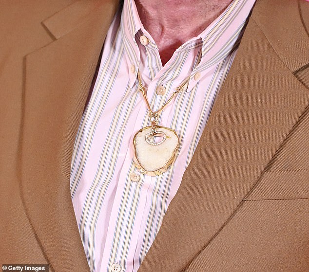 Elton attracted attention after wearing his old kneecap as a necklace during the premiere of his new biopic on Thursday