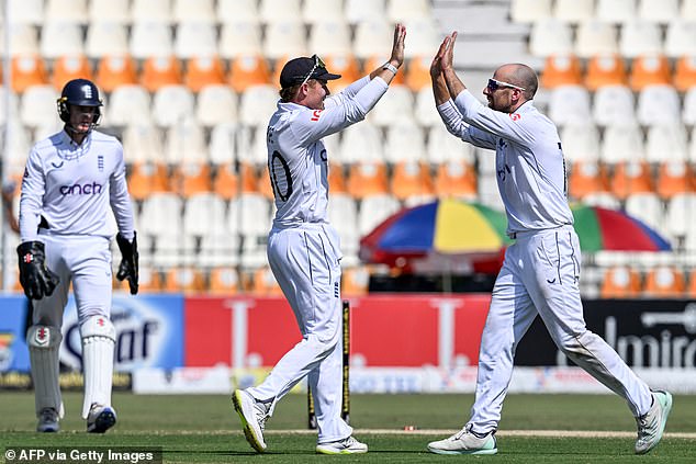 Jack Leach (right) took the last three wickets and fell as the Pakistanis were bowled out for 220