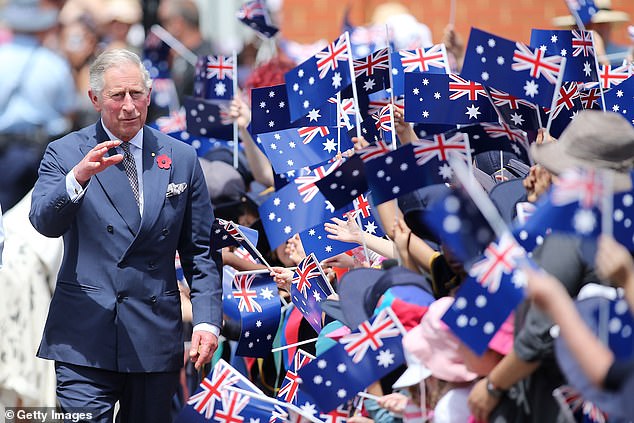 The King is greeted by schoolchildren during a visit to Kilkenny Primary School on November 7, 2012 in Adelaide