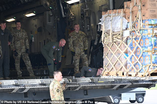 Members of the North Carolina Air National Guard transport essential supplies to Western North Carolina