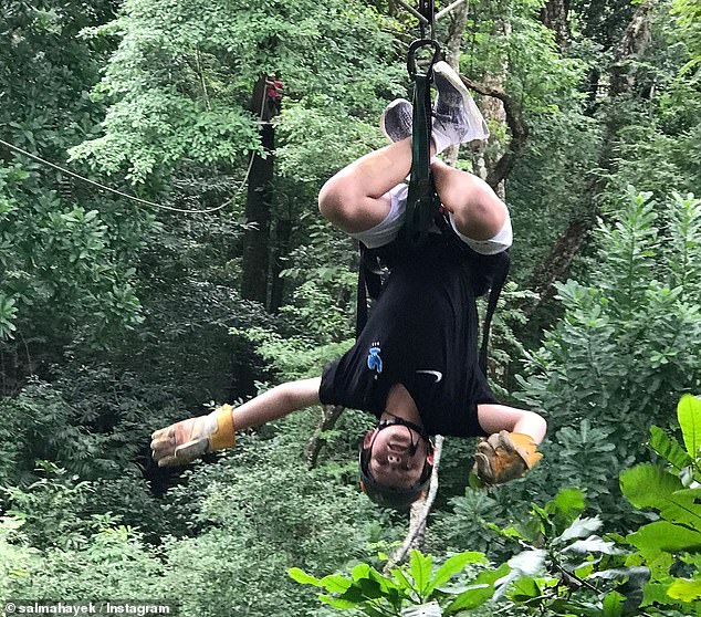 Salma has uploaded additional photos of her stepson over the years, such as one of him hanging upside down from a cable car in a forest