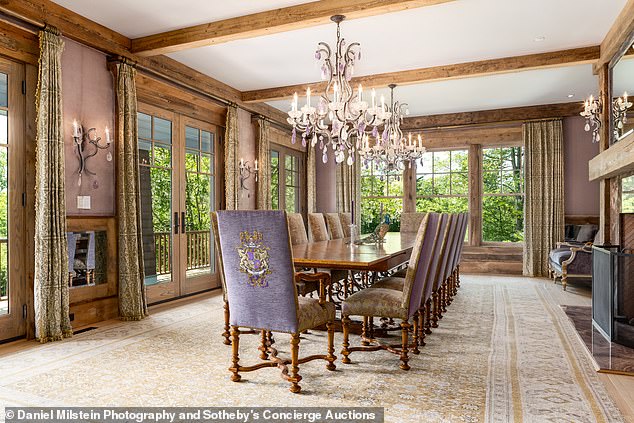 There is room for 12 people around this opulent and luxurious dining room