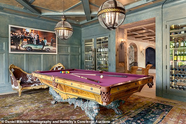 There's plenty of time for entertainment with a purple pool table in the games room