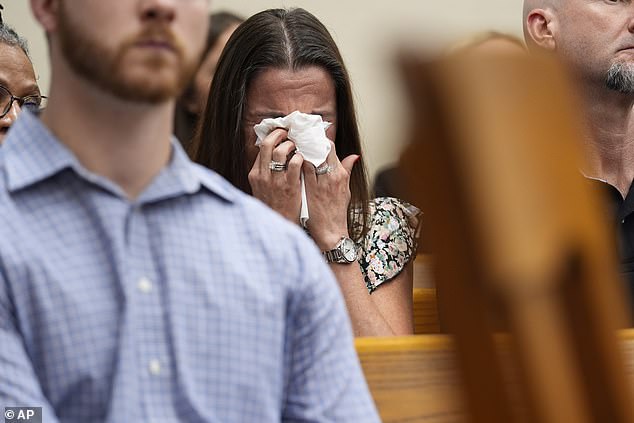 Phillips was seen covering her eyes with the tissue as a video played in court