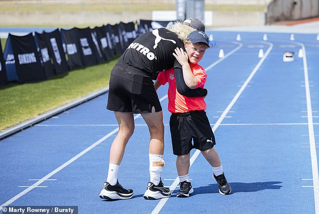 Marathon man Brockmann heard of Hugo's predicament and invited the youngster to run a lap alongside him on the Sydney Athletic Center track