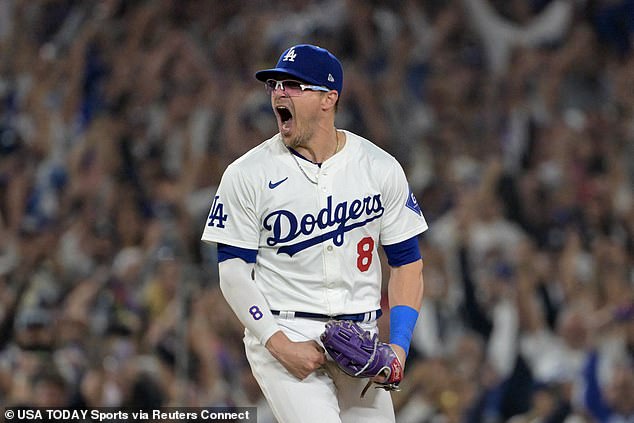 Hernandez celebrates after beating the San Diego Padres during Game 5 of the NLDS