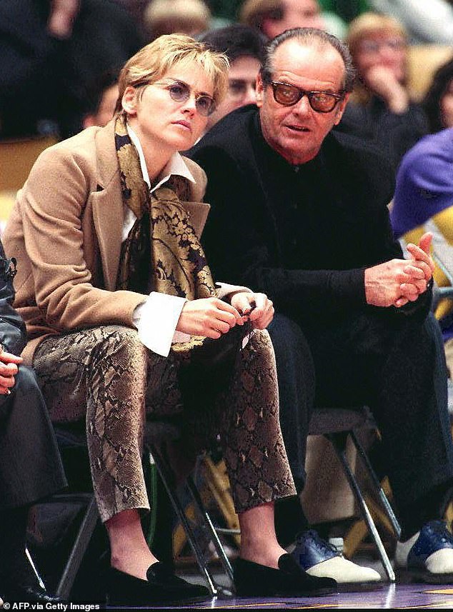 Sharon Stone and Jack Nicholson attend a Lakers-Nuggets game in the 1990s