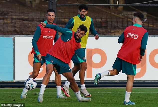 Fernandes (centre) prepares for Nations League clashes with Scotland and Poland