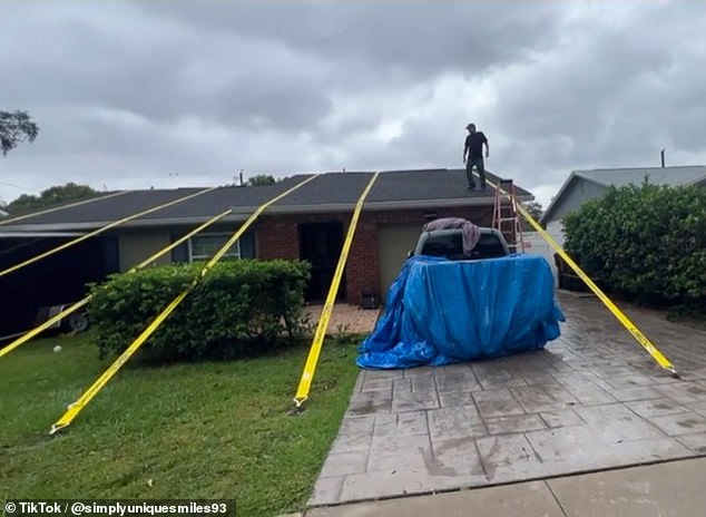 The family says the straps will remain on the house until hurricane season ends in December