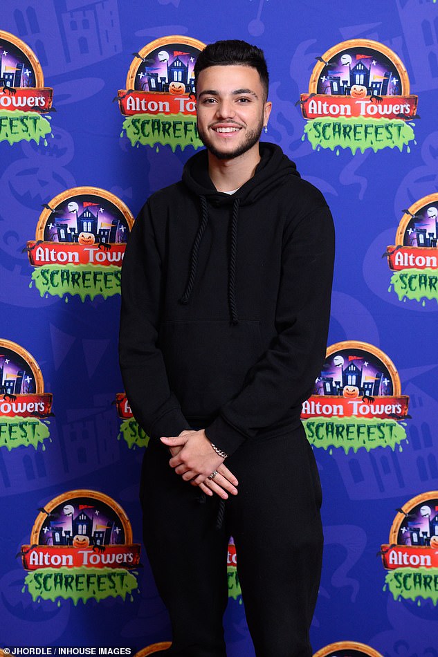 Junior wore a black hoodie and drawstring sweatpants as he posed up a storm on the red carpet