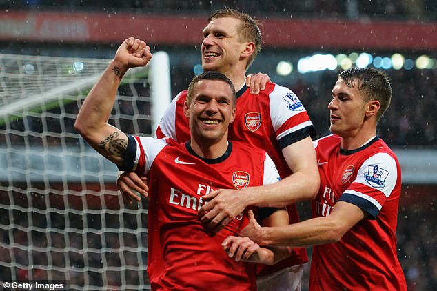 After spells at Cologne and Bayern Munich, Podolski (middle of the photo) joined Arsenal in 2012