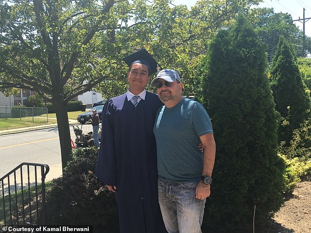 Ethan and Kamal pictured together at the young man's high school graduation