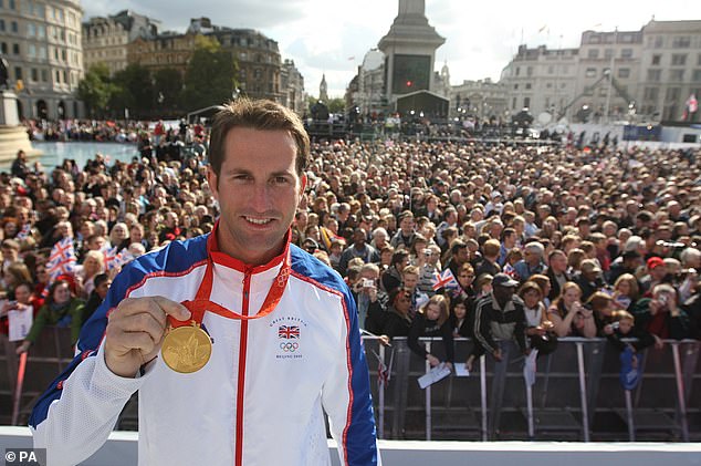 Ainslie pictured with one of his Olympic gold medals in Trafalgar Square in London in 2008